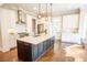 Open kitchen with an island, stainless steel appliances, and white cabinetry at 1566 Lindsey Creek Dr, Mount Pleasant, SC 29466