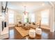 Bright living room showcasing a fireplace, comfortable seating, and hardwood floors at 1566 Lindsey Creek Dr, Mount Pleasant, SC 29466