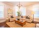Cozy living room with comfortable seating, decorative art, and natural light at 1566 Lindsey Creek Dr, Mount Pleasant, SC 29466