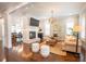 Spacious living room featuring a fireplace, modern lighting and hardwood floors at 1566 Lindsey Creek Dr, Mount Pleasant, SC 29466