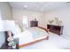 Bright main bedroom with neutral tones, ceiling fan, and en-suite bathroom at 1566 Lindsey Creek Dr, Mount Pleasant, SC 29466