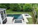 Stunning pool and patio area, fire bowls, and outdoor seating offer a relaxing oasis at 1566 Lindsey Creek Dr, Mount Pleasant, SC 29466