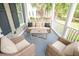 Cozy porch with comfortable seating offers an inviting outdoor living space at 1566 Lindsey Creek Dr, Mount Pleasant, SC 29466