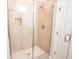 Beautifully tiled shower with glass door and neutral toned fixtures at 1566 Lindsey Creek Dr, Mount Pleasant, SC 29466