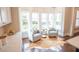 Bright and airy sitting area with large windows, comfortable chairs, and a hide rug at 1566 Lindsey Creek Dr, Mount Pleasant, SC 29466