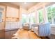 Bright and airy sitting area with large windows, comfortable chairs, and a hide rug at 1566 Lindsey Creek Dr, Mount Pleasant, SC 29466