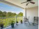 Inviting balcony with a ceiling fan, seating, and views of lush greenery at 1984 Folly Rd # A310, Charleston, SC 29412
