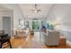 Bright living room with vaulted ceilings, hardwood floors and access to a patio at 1984 Folly Rd # A310, Charleston, SC 29412