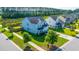 Aerial view of a blue two story home with a manicured lawn and neighborhood at 201 Bigleaf Ct, Summerville, SC 29486