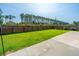 Beautifully landscaped backyard with green grass and a privacy fence at 201 Bigleaf Ct, Summerville, SC 29486
