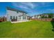 Large backyard featuring a hot tub, screened-in porch, and privacy fence at 201 Bigleaf Ct, Summerville, SC 29486