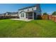 Spacious backyard with a screened-in porch and well-maintained lawn at 201 Bigleaf Ct, Summerville, SC 29486
