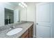 Bathroom vanity featuring granite counters, bright lighting, and wood cabinets at 201 Bigleaf Ct, Summerville, SC 29486