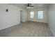 Cozy bedroom with two windows and a ceiling fan at 201 Bigleaf Ct, Summerville, SC 29486