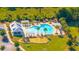 Aerial view of a community pool with lounge chairs, picnic pavilion, and mature trees at 201 Bigleaf Ct, Summerville, SC 29486