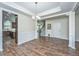 Open dining area showcases hardwood floors, modern lighting, and access to the kitchen at 201 Bigleaf Ct, Summerville, SC 29486