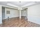Spacious dining room features hardwood floors, elegant lighting, and classic trim at 201 Bigleaf Ct, Summerville, SC 29486