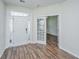 Bright entrance featuring a white front door, sidelights, and hardwood floors with French doors at 201 Bigleaf Ct, Summerville, SC 29486