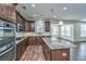 Kitchen featuring wood floors, a center island with granite countertops, stainless steel appliances, and natural light at 201 Bigleaf Ct, Summerville, SC 29486