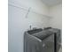 Modern laundry room with new washer and dryer plus wire shelving at 201 Bigleaf Ct, Summerville, SC 29486