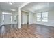 Bright living room with hardwood floors, white trim, and recessed lighting at 201 Bigleaf Ct, Summerville, SC 29486