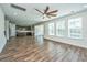 Living room with hardwood floors flowing into the kitchen and lots of natural light at 201 Bigleaf Ct, Summerville, SC 29486