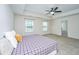 Comfortable main bedroom with a ceiling fan, tray ceiling, carpet, and ensuite access at 201 Bigleaf Ct, Summerville, SC 29486