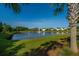 Scenic view of the pond with a fountain, lush greenery, and trees at 201 Bigleaf Ct, Summerville, SC 29486