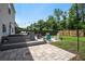 Landscaped backyard featuring a deck, patio, outdoor seating, and a well-maintained lawn at 2021 Asher Loop, Summerville, SC 29485