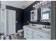 Modern bathroom features double sinks, granite counters, and a tiled shower at 2021 Asher Loop, Summerville, SC 29485