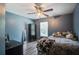 Comfortable bedroom with ceiling fan, wood floors, natural light and cozy decor at 2021 Asher Loop, Summerville, SC 29485