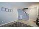 Open entryway with wood floors, staircase, and stylish decorative wall art at 2021 Asher Loop, Summerville, SC 29485