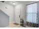 Bright entryway featuring wood floors, a white door, and a staircase leading to the upper level at 2021 Asher Loop, Summerville, SC 29485