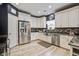 Modern kitchen with stainless steel appliances, white cabinetry, and granite countertops at 2021 Asher Loop, Summerville, SC 29485