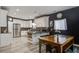 Bright eat-in kitchen features white cabinets, granite counters, stainless appliances and hardwood floors at 2021 Asher Loop, Summerville, SC 29485