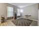 Cozy room with wood floors, neutral walls, and large windows providing ample natural light at 2021 Asher Loop, Summerville, SC 29485