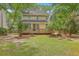 Beautiful backyard with a large deck, mature trees, and lush green grass at 2028 Prospect Hill Dr, Mount Pleasant, SC 29464