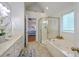 Bathroom with double vanity, jacuzzi tub, and glass-enclosed shower at 2028 Prospect Hill Dr, Mount Pleasant, SC 29464