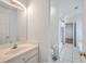 Well-lit bathroom featuring a sink and vanity, and an open doorway to the shower at 2028 Prospect Hill Dr, Mount Pleasant, SC 29464