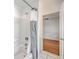 Bright bathroom featuring a shower with tile and hardware and an open doorway at 2028 Prospect Hill Dr, Mount Pleasant, SC 29464