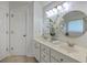 Bathroom features a double vanity, updated lighting, and modern fixtures at 2028 Prospect Hill Dr, Mount Pleasant, SC 29464