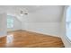 Large, well-lit attic bedroom with hardwood floors and a window overlooking trees at 2028 Prospect Hill Dr, Mount Pleasant, SC 29464