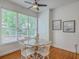 Breakfast nook with hardwood floors, lots of natural light, and white chairs around a table at 2028 Prospect Hill Dr, Mount Pleasant, SC 29464