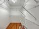Walk-in closet with ample shelving and hardwood floors at 2028 Prospect Hill Dr, Mount Pleasant, SC 29464
