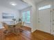Elegant dining room boasts a large window, hardwood floors, and a stylish chandelier at 2028 Prospect Hill Dr, Mount Pleasant, SC 29464