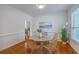 Dining room with hardwood floors, light walls, and wicker chairs around a table at 2028 Prospect Hill Dr, Mount Pleasant, SC 29464