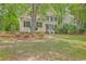 Two-story home with neutral siding, black shutters, and manicured landscaping at 2028 Prospect Hill Dr, Mount Pleasant, SC 29464