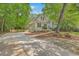 Two-story home with neutral siding, black shutters, concrete driveway and manicured landscaping at 2028 Prospect Hill Dr, Mount Pleasant, SC 29464