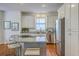 Bright kitchen with white cabinets, granite countertops, and stainless steel appliances at 2028 Prospect Hill Dr, Mount Pleasant, SC 29464