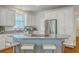 Kitchen with white cabinets, granite countertops, stainless steel appliances and breakfast bar at 2028 Prospect Hill Dr, Mount Pleasant, SC 29464